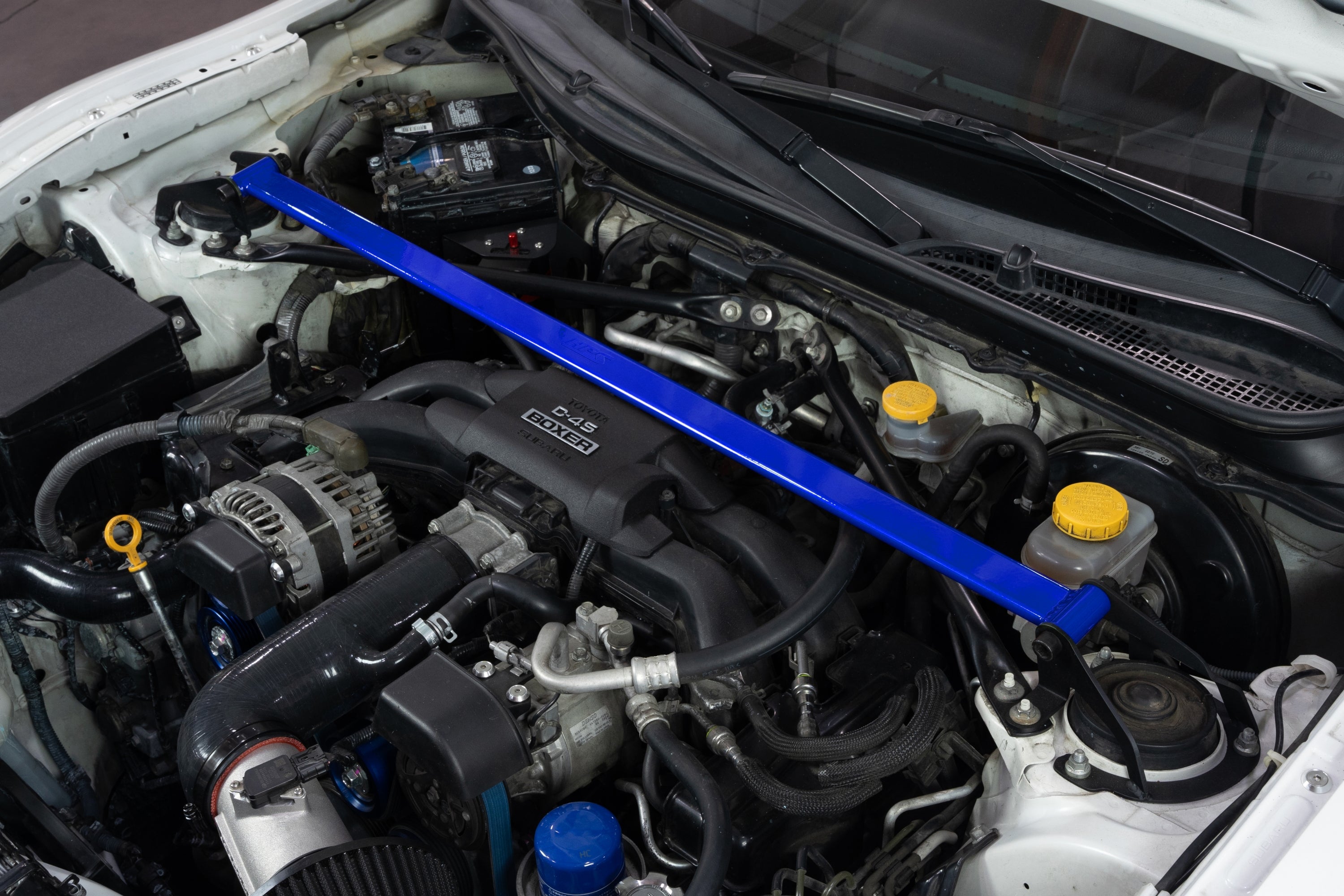 HPS Performance Blue Front Strut Bar installed on Scion FR-S Toyota 86 GR86 Subaru BRZ Polished 42-121BL