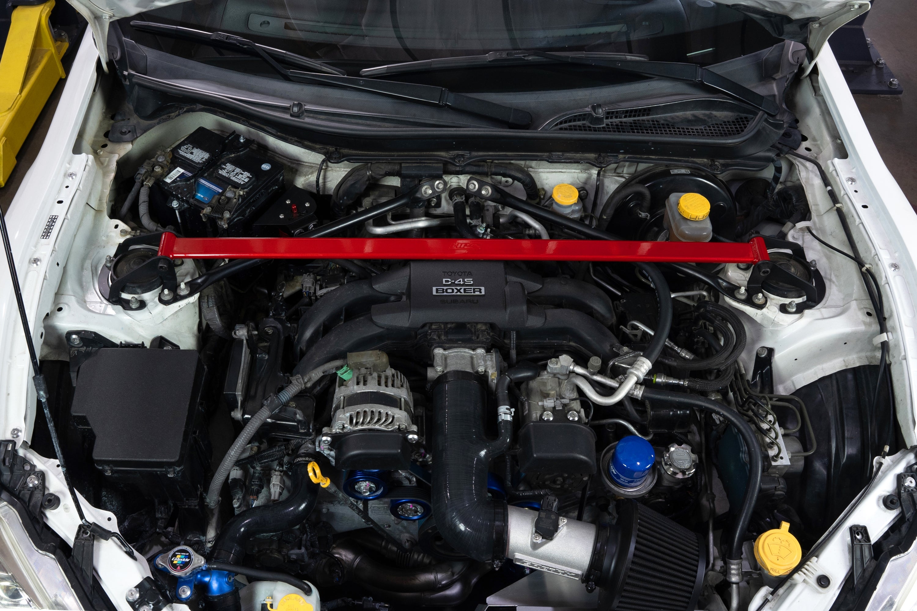 HPS Performance Red Front Strut Tower Brace Bar installed on 1st 2nd Gen Toyota 86 GR86 ZN6 ZN8 Subaru BRZ ZC6 ZD8 Polished 42-121R