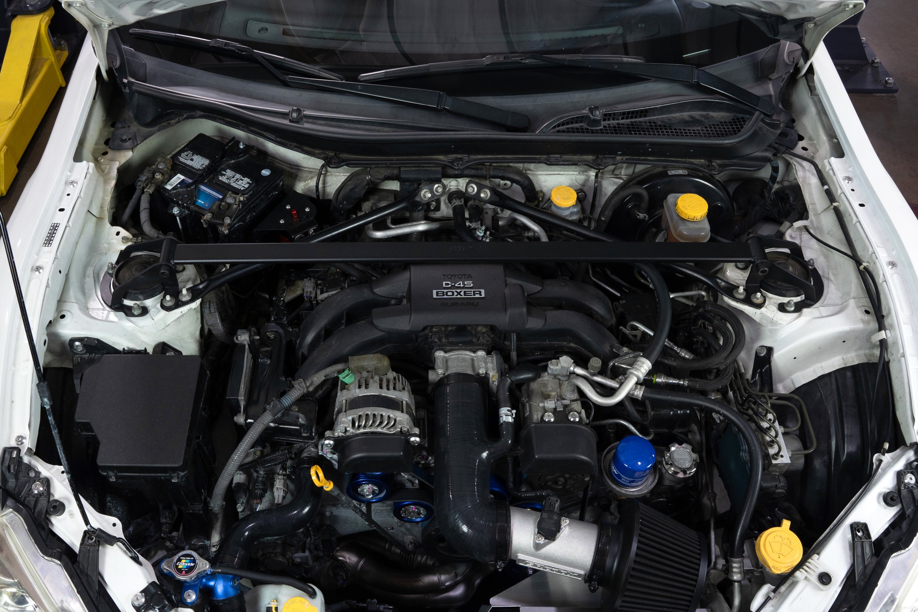 HPS Performance Black Front Strut Tower Brace Bar installed on 1st 2nd Gen Toyota 86 GR86 ZN6 ZN8 Subaru BRZ ZC6 ZD8 Polished 42-121WB