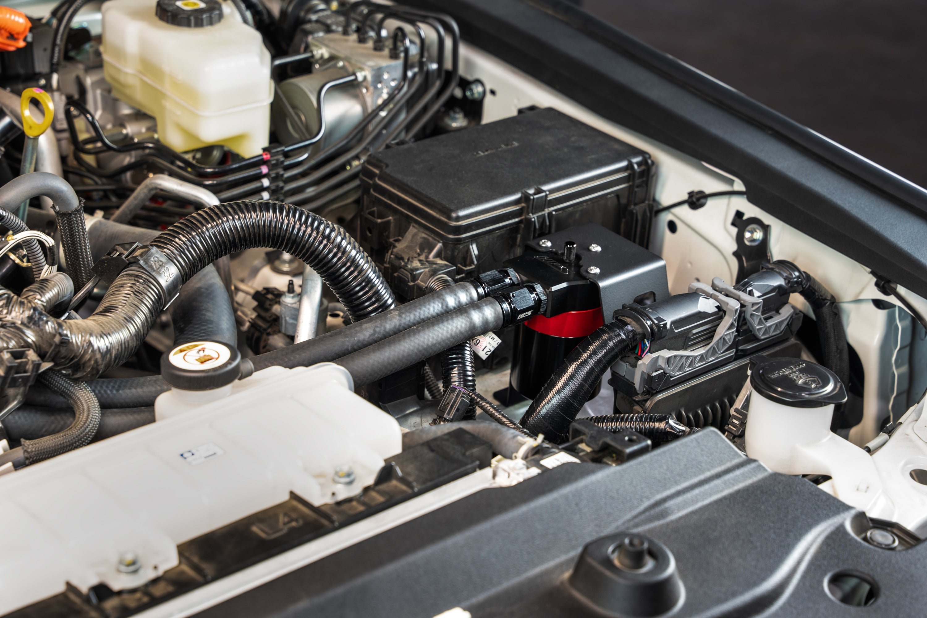 HPS Performance Aluminum Oil Catch Can Kit installed 5th Gen Toyota Land Cruiser 2.4L Turbo 860-024